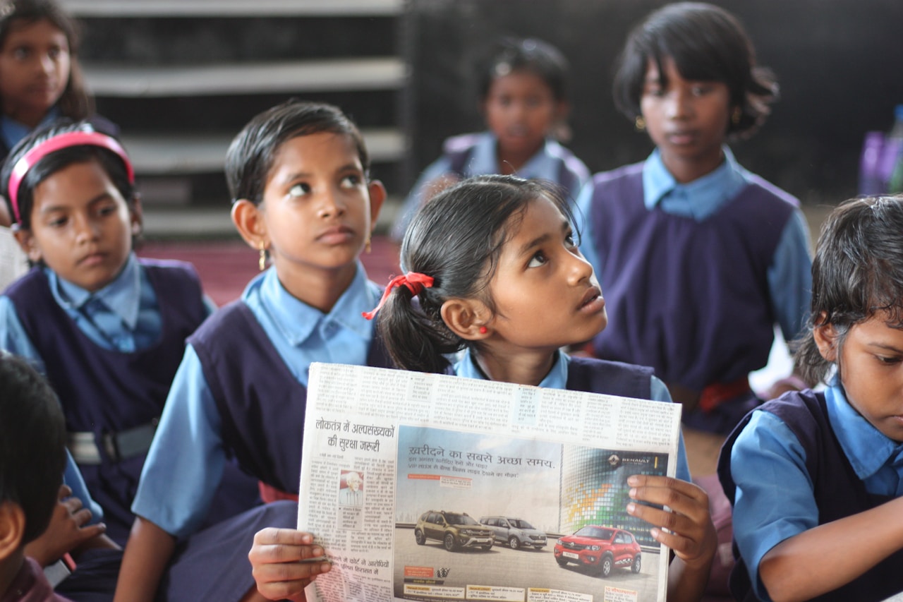 Child rights awareness - girl reading newspaper