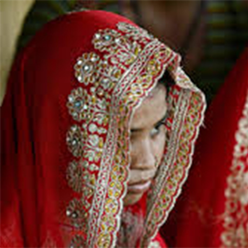 Child marriage awareness - girl in wedding veil